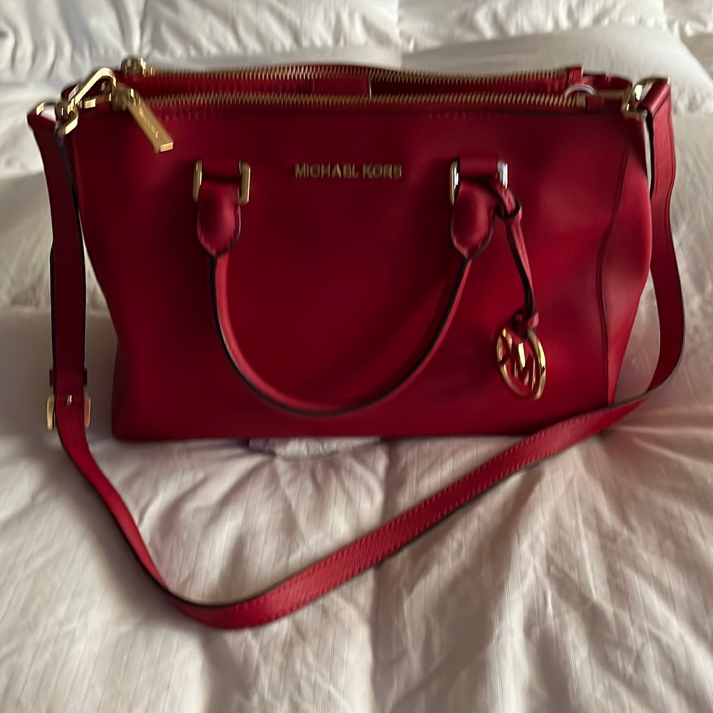 Michael Kors purse. Lots of pockets, Gold trim. Classic style